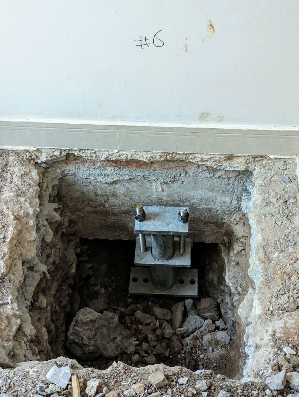 Installed steel micropile connected to the existing ground beam